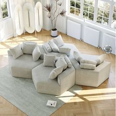 a large sectional couch sitting on top of a wooden floor next to a white radiator