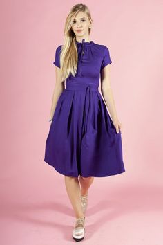 Purple Dress for Women, Plus size Flower dress with front bow ➤ Features > dress length: 115cm / 45,27''  > bow dress > short sleeves > separated belt > pleats in skirt part > knee length ➤ Sizing My Size Guide in FAQ section below will help you define the perfect size match.  The item can also be made according to your measurements - just message them to me.  ➤ Delivery Your item is made-to-order and will be ready within 2-7 days.  Average delivery times: > Europe: up to 1 week > North America: Solid Color Knee-length Dress With Bow, Short Sleeve Dresses With Bow For Daywear, Knee-length Dress With Bow Detail, Fitted Solid Color Dress With Bow, Fitted Dress With Bow Detail, Fitted Knee-length Midi Dress With Bow, Fitted Midi Dress With Bow, Knee-length, Summer Work Dresses With Bow Detail, Summer Workwear Dresses With Bow Detail