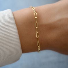 "Dainty paperclip bracelet, perfect for stacking or alone for a minimalist, chic look. - - D E T A I L S - - ▪︎ VERY THICK plating of 14k gold over brass ▪︎ High quality and dainty ▪︎ Measures 6.75\" + .5\" Extension ▪︎ Lobster Claw Closure ▪︎ Nickel-free ▪︎ Each link measures: Bracelets on Model: https://www.etsy.com/listing/911249137/beaded-bracelet-gold-bead-bracelet-gold?ga_search_query=beaded&ref=shop_items_search_3&pro=1 https://www.etsy.com/listing/846628095/evil-eye-red-string-br Simple Diamond Ring, Gold Bracelets Stacked, Paperclip Bracelet, 18k Gold Bracelet, Bracelet Stacking, Red String Bracelet, Gold Armband, Simple Diamonds, Gold Bead Bracelets