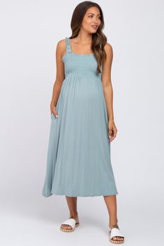 A comfortable & casual maternity dress perfect for any day!  A solid maternity midi dress with ruffle straps and a smocked bodice. Pocketed. The Light Blue Smocked Ruffle Strap Maternity Midi Dress is perfectly bump-friendly! Summer Maternity Dress With Smocked Back, Maternity Midi Dress With Smocked Back, Casual Summer Maternity Dress With Ruched Details, Casual Maternity Dress With Smocked Back, Casual Maternity Dress With Smocked Bodice, Summer Flowy Maternity Dress With Smocked Back, Summer Maternity Dress With Smocked Bodice, Summer Maternity Midi Dress With Smocked Back, Summer Maternity Smock Dress