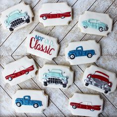 decorated cookies with cars and not old classic written on one cookie, sitting on a wooden table