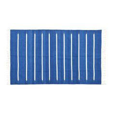 a blue rug with white stripes on the bottom and fringes in the middle, against a white background