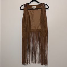 Suede Tassel Vest With Stripped Pattern On The Back Never Worn Bohemian Spring Outerwear With Fringe, Brown Tasseled Outerwear For Spring, Fitted Outerwear With Tassels For Spring, Fitted Spring Outerwear With Tassels, Brown Fringe Outerwear For Spring, Chic Fringe Outerwear For Festivals, Chic Festival Outerwear With Fringe, Bohemian Festival Outerwear With Beaded Fringe, Bohemian Brown Outerwear With Tassels