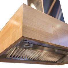 a close up view of a wooden stove hood