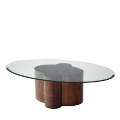 an oval glass table with two wooden bases