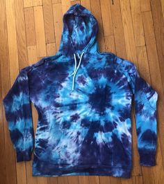 Tie-dye adult hoodie sweatshirt, pullover, kangaroo pocket, drawstring on hood. Hand-dyed. 100% cotton. Machine washable. Sizes run small. Sizes XL - 3X available; please inquire if the color you want is available in the size you want. If you want a color or size I don't have here, let me know and I'll custom-make one for you! Also, hoodies with a zipper available on a custom-order basis for an additional cost. Blue Streetwear Hoodie With Drawstring, Blue Drawstring Hoodie Sweatshirt, Blue Hoodie With Drawstring For Winter, Blue Drawstring Hoodie For Winter, Acid Wash Cotton Hoodie, Acid Wash Hoodie Sweatshirt With Drawstring, Acid Wash Cotton Hoodie With Kangaroo Pocket, Spring Blue Hoodie With Drawstring, Acid Wash Hoodie With Drawstring Hood And Crew Neck