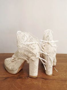 Planing a forest themed wedding? These lace embellished bridal shoes with block heels compliment your dress beautifully and keep you comfortable all night long. #laceshoes #bridalshoes #blockheels #forestwedding #weddingshoes Lace Wedding Shoes For Bridal Shower, Bohemian Closed Toe Party Heels, Vintage White Heels For Wedding, Lace High Heel Wedding Shoes With Laces, Lace Wedding Shoes With High Heels And Laces, Lace Wedding Shoes With Lace Trim And Round Toe, Lace Wedding Shoes With Round Toe And Lace Trim, Bohemian High Heel Party Heels, Lace Wedding Shoes With White Laces