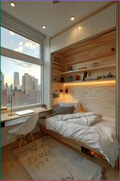 a bedroom with a bed, desk and window overlooking the cityscape in the distance