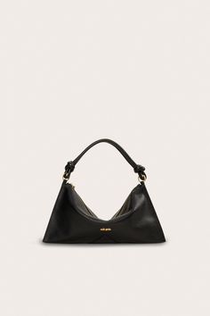 A redesigned classic leather shoulder bag with a knotted strap and slouchy silhouette. — Shoulder bag — Knotted strap — Zipper closure — Smooth leather Cult Gaia Bag, Cult Gaia, Mini Shoulder Bag, Classic Leather, Smooth Leather, Leather Shoulder Bag, Shoulder Bag, Zipper, Handbags