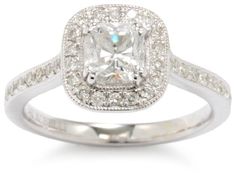 an engagement ring with a cushion cut diamond in the center