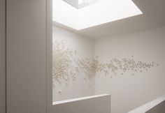 a white room with a skylight above it