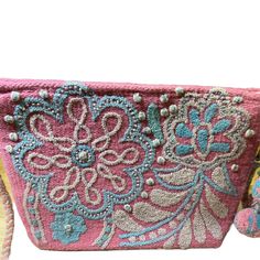 Our unique and beautiful hand embroidered "cosmetic bags" can be used to carry all your beauty essentials, perfect for daily use and ideal for travel; as well as convert to a Crossbody Bag. Made by female Artisans from Peru from hand loomed wool yarns, with hand embroidered coloful emblishements. Each tasseled bag has cotton lining and detachable matching wool braided strap. 11 1/2 "x 8" x 3" They are designed to be the perfect gift to make someone feel special! Embroidered Shoulder Beach Bag For Daily Use, Multicolor Embroidery Crossbody Shoulder Bag, Rectangular Bags With Multicolor Embroidery And Adjustable Strap, Rectangular Bag With Multicolor Embroidery And Adjustable Strap, Multicolor Embroidered Rectangular Bags With Adjustable Strap, Embroidered Rectangular Beach Bag For Daily Use, Daily Use Multicolor Embroidered Shoulder Bag With Adjustable Strap, Embroidered Shoulder Beach Bag, Embroidered Rectangular Beach Bag