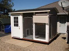 a dog kennel in front of a house