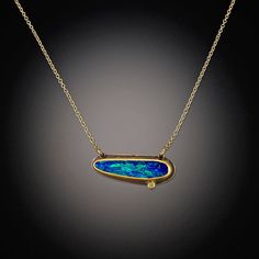 This vibrant necklace features a magical Australian opal, accented with a twinkling diamond dot. The stones are wrapped in 22k gold, backed with sterling silver, and float on a 14k gold chain. Pendant measures approximately 3/4" wide. Matte finish. Each stone is unique and may vary slightly from image. Best Jewellery Design, Gold Chain Pendant, Australian Opal Jewelry, Necklace With Diamond, Inlay Jewelry, Wire Jewellery, Opal Pendant Necklace, Art Jewelry Contemporary, Triangle Necklace