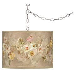 a chandelier hanging from a chain with flowers on it