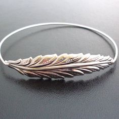 "Long Silver Tone Leaf Bracelet - Fall Fashion - Fall Jewelry - A long silver tone leaf will be transformed into a delicate leaf bangle bracelet with bangle band choice of silver filled or sterling silver. This Fall bracelet also available in a gold tone leaf with bangle band in brass or 14k gold filled. Perfect for Autumn wedding jewelry for the bride or Autumn bridesmaid jewelry, or for anyone who loves nature jewelry. This Autumn bangle bracelet looks great stacked with other bangles from my Winter Wedding Jewelry, Fall Wedding Jewelry, Unique Wedding Jewelry, Silver Leaf Bracelet, Bridal Bracelet Pearl, Autumn Bracelet, Leaf Bracelet, Elegant Bracelet, Pretty Bracelets