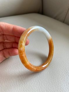 "🌈 Jade Bangle 53.4mm (2.10\"), Round Shape, Light Green & Yellow Brown 🌷 Untreated Natural Jadeite/ Grade A Jade 🌷 Certified : Yes 🌷 Jade from Myanmar/ Burma 🌷 Shape : Round 🌷 Inner diameter : 53.4mm / 2.10\" 🌷 Width & Thickness : 8.3 x 8.6mm 🌷 Color : Light Green & Yellow Brown 🌷 Free standard shipping from Hong Kong with tracking included 🌷 Take approximately 7-21 days to arrive worldwide" White Carved Bracelets, White Carved Round Bracelet, Handmade Orange Round Bangle, Lavender Green, Jade Bangle, Parent Gifts, 21 Days, Yellow And Brown, Myanmar