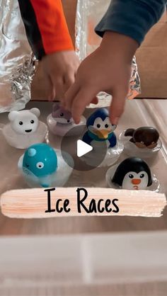 an image of ice races with penguins and penguinies on the table in front of them