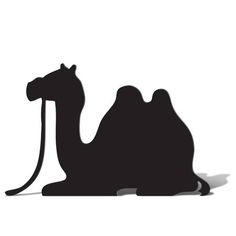 a black and white silhouette of a camel with a long tail sitting on the ground