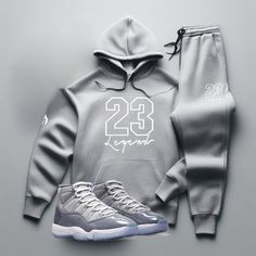 Yo, you looking for the freshest, most comfortable gear that perfectly matches your kicks? Check out our "23 Legend" Grey Sneaker Sweatsuit To Match Air Jordan Retro 11 Cool Grey colorway! So don't wait. Cop now and step up your game with our FIRE! "23 Legend" Men's Grey Sneaker Sweatsuit To Match Air Jordan Retro 11 Cool Grey. With fast shipping, hassle-free returns, and on-point customer service, Threads On Fire is the only choice for real sneakerheads who demand the FIRE! Check out our Sneake Fall Outfits Men Streetwear, Nike Clothes Mens, Grey Tracksuit, Air Jordan Retro 11, Outfits Men Streetwear, Jordan Retro 11, Grey Hoodie Men, Jordan Shoes Retro, Retro 11