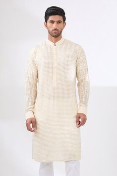 Ivory kurta with sequin and thread tonal embroidery in geometric pattern. Paired with a white pant. - Aza Fashions Traditional Wedding Wear With Geometric Embroidery, Elegant Festive Kurta With Geometric Embroidery, Geometric Embroidered Kurta For Eid Wedding, Geometric Embroidery Kurta For Wedding On Eid, Traditional Festive Sherwani With Geometric Embroidery, Geometric Embroidery Kurta For Wedding And Eid, Geometric Embroidery Kurta For Eid Wedding, Designer Traditional Kurta With Geometric Embroidery, Festive White Kurta With Geometric Embroidery