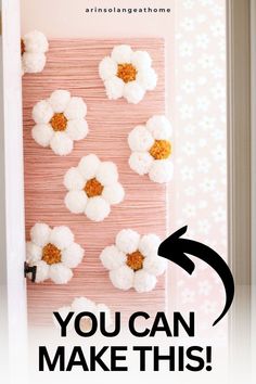 the door is decorated with crochet flowers and text that reads, you can make this