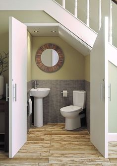 an open door leading to a bathroom with a toilet and bidet in it's center