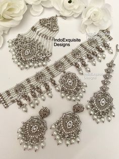 Elegant Pakistani bridal set/Pakistani Jewelry/ Indian and Pakistani wedding jewelry/ Bollywood jewelry/ kundan and Polki jewelry This elegant choker set comes with Earrings, tikka and Jhoomer/Passa/ Silver color  All items are shipped from Brampton, Ontario, Canada. If you need your item by a certain day, please reach out to us for express delivery option before placing the order so that we can update the shipping for you. Standard shipping/delivery timeline Below are the delivery timeline estimates. We dispatch all orders by the next business day. ---> USA delivery timeline * 2-6 business days to major urban centers in USA. It may take 1-2 days extra to remote locations ---> Canada delivery timeline  * 2-3 business days - GTA  & Montreal  * 2-4  business days - Rest of Ontario/Quebec * 2 Silver Bridal Earrings With Stone Work For Reception, Silver Kundan Sets For Festive Occasions, Silver Kundan Sets For Festive Season, Festive Silver Kundan Set, Silver Sets With Stone Work For Wedding, Heavy Silver Bridal Earrings For Wedding, Silver Wedding Sets With Stone Work, Festive Kundan Silver Sets, Silver Traditional Sets For Reception