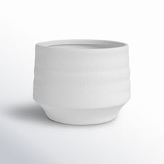 a white bowl sitting on top of a table