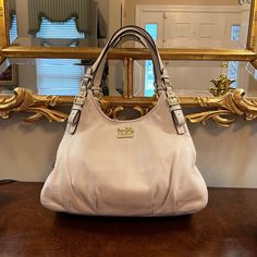 Hello! I Am Selling My Cream/Ivory-Colored Coach Hobo Bag With Gold Hardware. The Bag Is In Good Used Condition And Beautiful! There Is A Bit Of Wear, Which I Photographed. The Main Area Of Wear Is On The Back Of The Bag (Which Would Be Against The Body) Where There Is A Light Gray/Blue Rub From Jeans. There Are 3 Roomy Compartments Inside The Bag. 13.5 Inch Width, 9 Inch Height, 7 Inch Depth Coach Hobo Bag, Coach Hobo, There Is A Light, Hobo Shoulder Bag, Hobo Bag, Coach Bags, Light Gray, Gold Hardware, Blue Grey