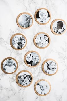 some cookies with pictures on them sitting on a marble counter top next to each other