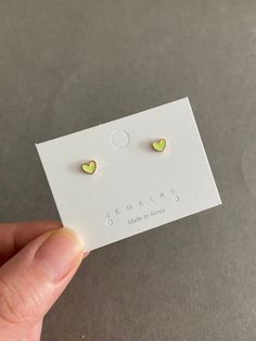 Tiny Heart Stud Earrings - Sterling Silver Pin Post Materials : Sterling Silver Pin Post Color : Yellow Neon / Orange / Green Size : 5mm Quantity: One pair * Stud Pin Post are Sterling Silver * Suitable for delicate and sensitive ears. * Comes in a jewelry box. If you need extra boxes for gifting....just let us know! Green Heart Charm Earrings For Valentine's Day, Green Heart-shaped Earrings For Valentine's Day, Green Heart Earrings For Valentine's Day, Green Heart-shaped Earrings For Anniversary, Green Heart Earrings For Valentine's Day Anniversary, Green Heart Earrings For Anniversary On Valentine's Day, Cute Green Heart Earrings For Gift, Yellow Heart Earrings For Gift, Yellow Heart-shaped Earrings For Gift