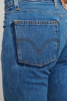 A unique pair of Levi's reworked denim jeans - featuring two tone pockets, frayed and exposed hem, and button fly. 100% Cotton. Waist: 27” - Hips: 36” - Rise: 9.5” - Inseam: 36” - Leg Opening: 7”. Fits like 26-27. Model is waist size 26. Dark Wash Cropped Denim Jeans With Contrast Stitching, Dark Wash Cropped Jeans With Contrast Stitching, Levi's Denim Blue Flare Jeans With Five Pockets, Levi's Denim Flare Jeans With Five Pockets, Levi's Rigid Denim Jeans, Denim Jeans With Contrast Stitching And Cropped Leg, Blue Jeans With Contrast Stitching In Rigid Denim, Cropped Leg Denim Jeans With Contrast Stitching, Medium Wash Rigid Denim Jeans With Contrast Stitching