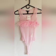 Women's Forever 21 Sheer Pink Sleeveless Bodysuit With Pink Soft Feather Across The Bust. New With Tags. Sexy And Feminine. Measurements; Pit To Pit 16 Inches (Unstretched), Length 23 1/2 Inches (Unstretched). Fitted Tank Top For Summer Clubbing, Fitted Tank Top For Club In Summer, Fitted Tank Top For Club And Summer, Glamorous Spring Club Tank Top, Trendy Summer Tank Top For Night Out, Chic Sleeveless Bodysuit For Party Season, Fitted Tank Top For Spring Clubbing, Fitted Tank Top For Club In Spring, Chic Sleeveless Party Bodysuit