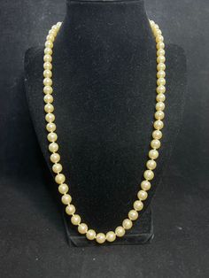 "Vintage Single Strand Faux Pearl Necklace. There are no hallmarks on it. There are knots between each pearl. The pearls do not glow. It has a gold tone hook and box clasp. The necklace measures: 23\" Each pearl measures: 8.0 mm It comes with a gift box. (Jewelry # 322) USA Seller!! Estate sale find. We do not Clean or Polish our Estate Jewelry we will leave that to you. We also have Jewelry, Hallmark Ornaments, Dept 56, Vintage Glassware and many other items. We will combine shipping for multiple items if possible. Features: * Single Strand/Hook And Box Clasp Size: Womens 23\" Condition: Pre-Owned Good -" Gold Beaded Pearl Necklace For Formal Occasions, Formal Costume Pearl Necklace, Single Strand Pearl Necklace Costume Jewelry, Single Strand Pearl Necklace For Costume Jewelry, Single Strand Pearl Costume Jewelry Necklace, Single Strand Pearl Costume Necklace, Gift Box Jewelry, Estate Sale Finds, Dept 56