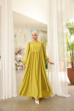 Indulge in timeless elegance with our Long Maxi Dress - Abaya - Available in 13 colors. Elegant Solid Color Dresses For Eid, Elegant Solid Color Abaya For Eid, Elegant Flowy Spring Abaya, Elegant Solid Color Abaya With Modesty Panel, Elegant Floor-length Solid Abaya, Solid Maxi Dress With Modesty Panel, Wedding Dresses For Eid, Elegant Tunic Maxi Dress For Eid, Elegant Abaya With Modesty Panel