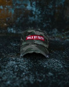 a walk by faith hat laying on the ground