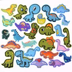 an assortment of dinosaur stickers on a white background