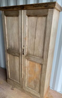 an old wooden armoire with two doors