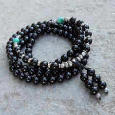 patience-108-bead-mala-onyx-wrap-bracelet Bohemian Black Bracelets For Meditation, Spiritual Onyx Beaded Bracelets For Meditation, Black Bohemian Beaded Bracelets For Meditation, Black Hematite Jewelry For Meditation, Spiritual Beaded Bracelets For Layering, Black Bohemian Beaded Bracelets With Gemstone Beads, Bohemian Black Gemstone Beaded Bracelets, Spiritual Black Natural Stone Beads, Bohemian Black Bracelets With Polished Beads