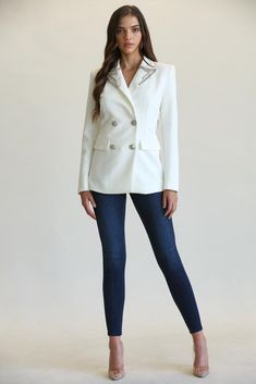 This blazer is not your average blazer. Cut from a solid woven stretch fabric for suiting, the blazer has rhinestone beaded embellishments along the trim of the lapel collar and silver buttons for a front closure. "Dazzle Me White Blazer Jacket" Full lined Princess seams Double breasted Polyester/Spandex Dry clean Imported Luxury White Embroidered Blazer, White Structured Blazer With Button Closure, White Embellished Long-sleeved Blazer, Tailored White Single-breasted Blazer, White Single-breasted Collared Blazer, Silver Buttons, White Blazer, Rhinestone Bead, Princess Seam