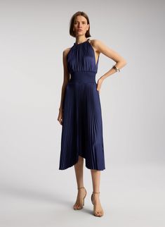 front view of woman wearing navy blue sleeveless pleated midi dress Satin Pleated Dress, Pleated Satin Dress, Metallic Sandals, Halter Neckline, Signature Collection, New Arrival Dress, Shop Dresses, Pleated Dress, Ball Gowns