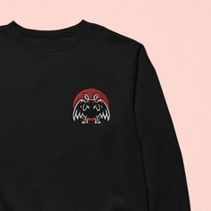 One of our favorite cryptids, MOTHMAN! 💀 FREE SHIPPING ON USA ORDERS OVER $35 💀 * High quality embroidery * Unisex, women may want to size down * 65/35 cotton/polyester * Pre-shrunk Casual Sweatshirt With Front And Back Print, Casual Long Sleeve Sweatshirt With Front And Back Print, Casual Sweatshirt With Long Sleeves And Front-back Print, Casual Sweatshirt With Long Sleeves And Prints, Black Sweater With Embroidered Graphics For Streetwear, Black Embroidered Cotton Sweater, Black Cotton Embroidered Sweater, Winter Cotton Sweatshirt With Front And Back Print, Black Cotton Sweater With Embroidered Graphics