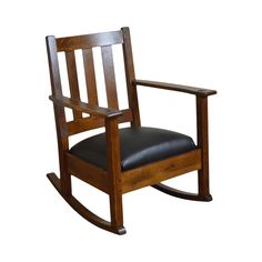 a wooden rocking chair with black leather seat and armrests on an isolated white background