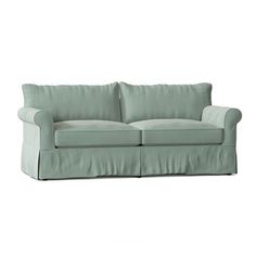 an image of a couch that is in front of a white background and it has a light green color