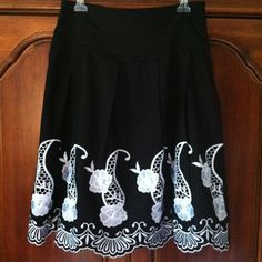 Black Skirt With Delicate White Embroidered Flowers On Front. Flat Pleats On Front And Back. Fully Lined. Across Waist 15 Inches. Length 25 Inches. Flowers Color, Flowers Black, Black Skirt, Embroidered Flowers, Womens Skirt, Black White, Black And White, Skirt, Flowers