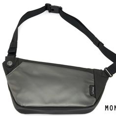 a black and gray fanny bag with the word mono on it's front pocket