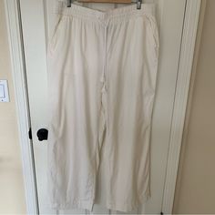 Flowy And Lightweight Linen Blend Pants By Lane Bryant Women's Size 16 Front Pockets Back Pockets Linen Blend White Color Wide Leg Elastic Waist With Drawstring Approximate Measurements While Laying Flat Inseam 30" Rise 14" Smoke Free Home Pet Friendly New With Tags Make Me An Offer! Don’t Forget To Bundle. 10% Off 2 Items Or More! White Stretch Bottoms With Drawstring, White Bottoms With Drawstring And Long Pants, White Drawstring Long Pants, White Drawstring Wide Leg Pants For Summer, Summer White Wide Leg Pants With Drawstring, White Cotton Wide Leg Pants With Drawstring, Spring Relaxation Bottoms With Drawstring, Spring Relaxation Drawstring Bottoms, White Wide Leg Pants For Relaxation