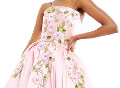 Strapless box pleat couture gown in light pink textured fabric embroidered with pink and green floral vine beading.