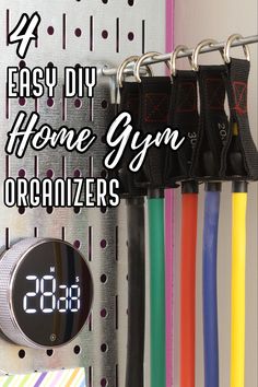 Home gym wall Organization Home Gym Wall Organizer, Creative Home Gym Storage, Peloton Garage Ideas, Fitness Storage Ideas, Exercise Equipment Wall Storage, Basement Gym Storage Ideas, Gym Wall Organization Ideas, Home Gym Accessories Storage, Home Gym Storage Wall